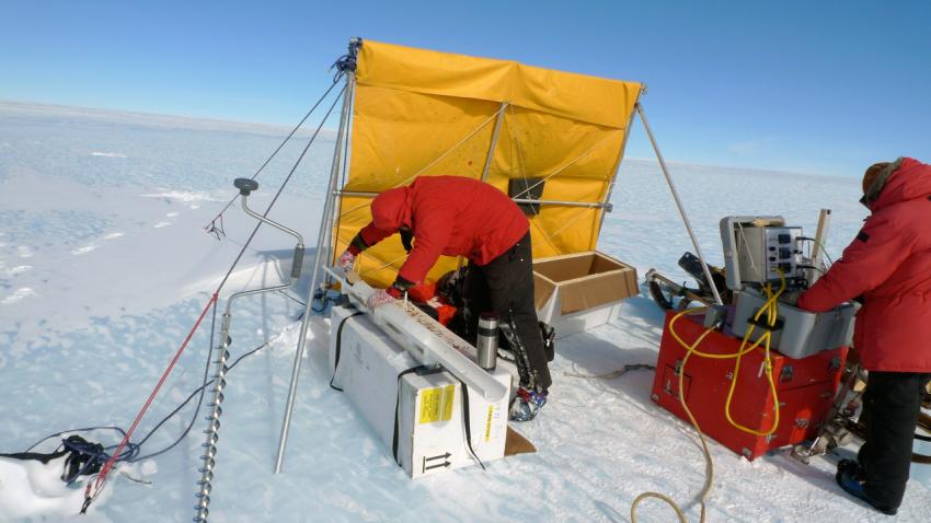 Mike Waszkiewicz drills with the Eclipse Drill while John Higgins packs core at Allan Hills, Antarctica