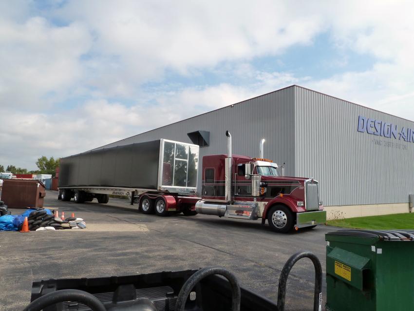 The loaded Conestoga trailer leaves the IDP-Wisconsin Warehouse, bound for Port Hueneme, CA