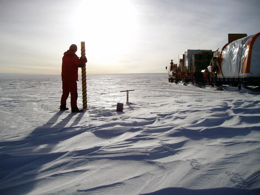 A scientist uses a PICO hand auger in the middle of East Antarctica during the Norwegian-U.S. Traverse of East Antarctica