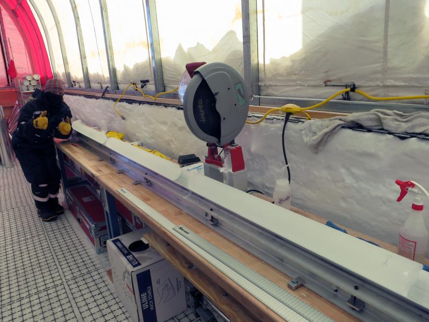 Mindy Nicewonger at the core processing station inside the drill tent for the South Pole Ice Core project