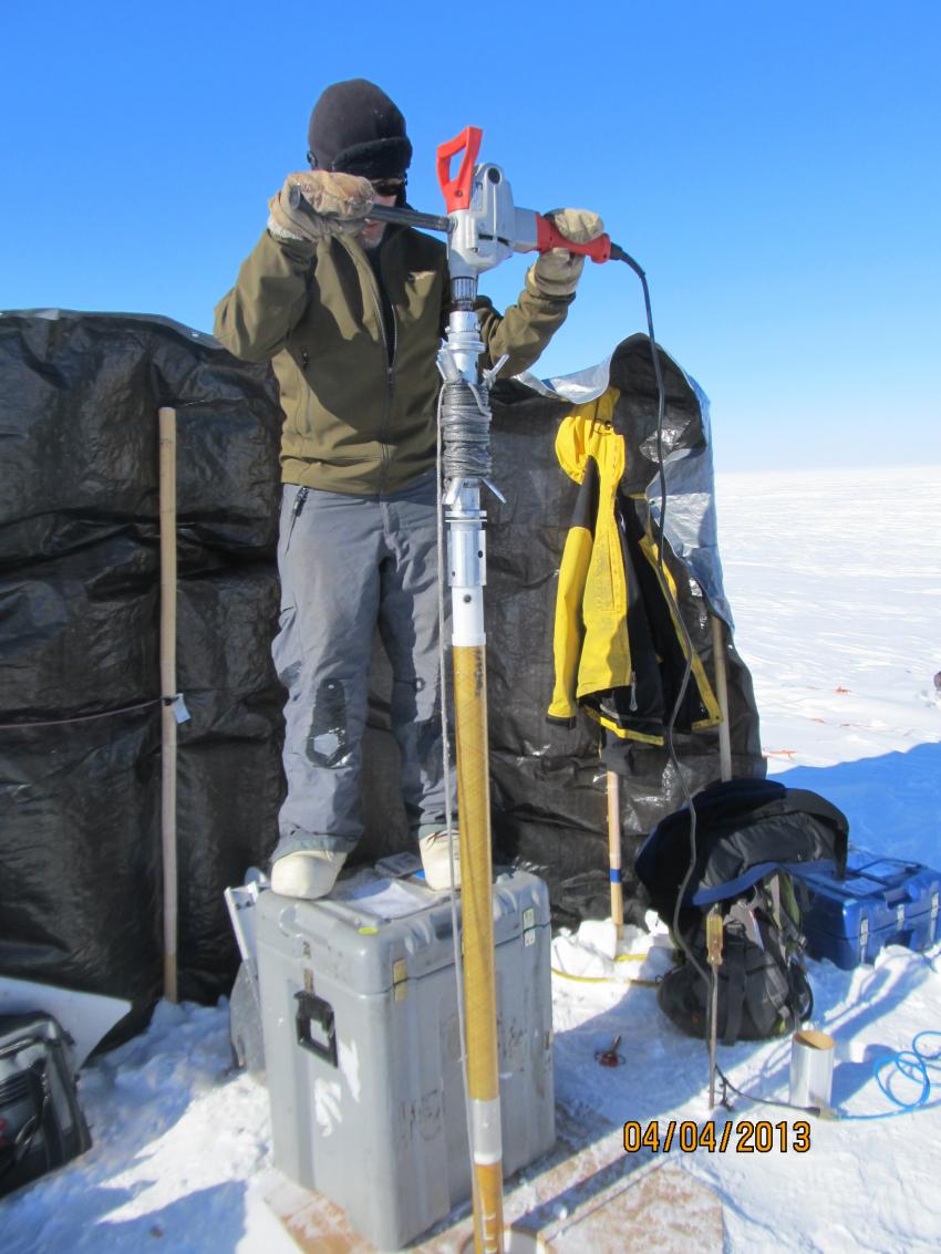IDP driller Jay Kane drills with the PICO Hand Auger and Sidewinder system during the 2013 field season in SE Greenland