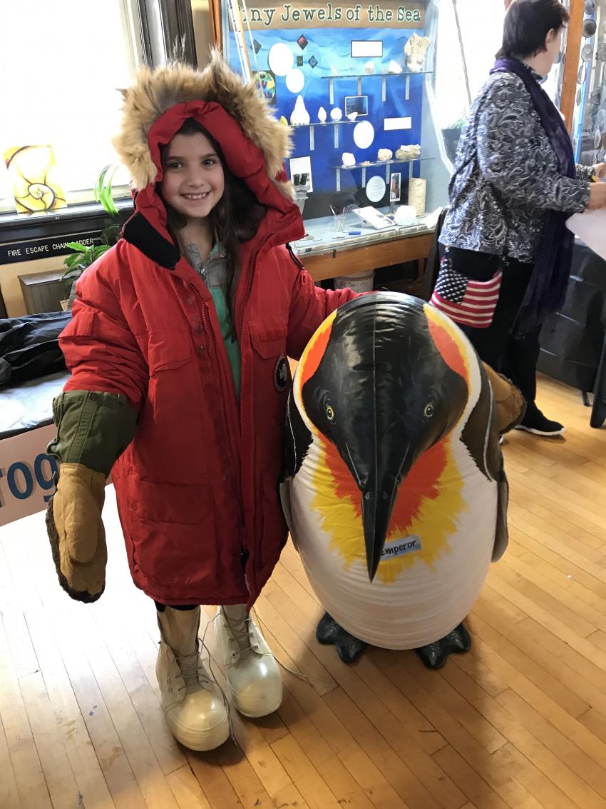 Students and their parents engage in hands-on activities while learning about ice core science and the challenges of working in the polar regions.