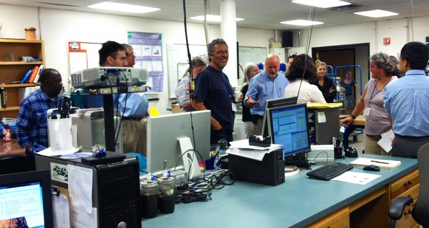 School of Ice partner Bruce Vaughn leads 2015 professors on a tour of CU- INSTAAR's stable isotope laboratory