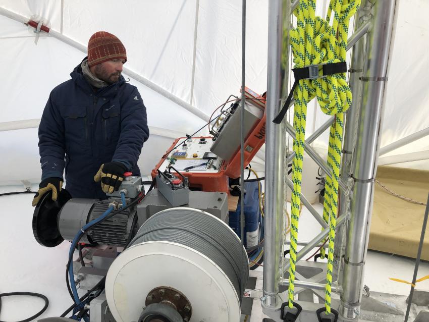 Tanner Kuhl operates the Blue Ice Drill with a new tower at Allan Hills, Antarctica, during the 2019/20 field season.