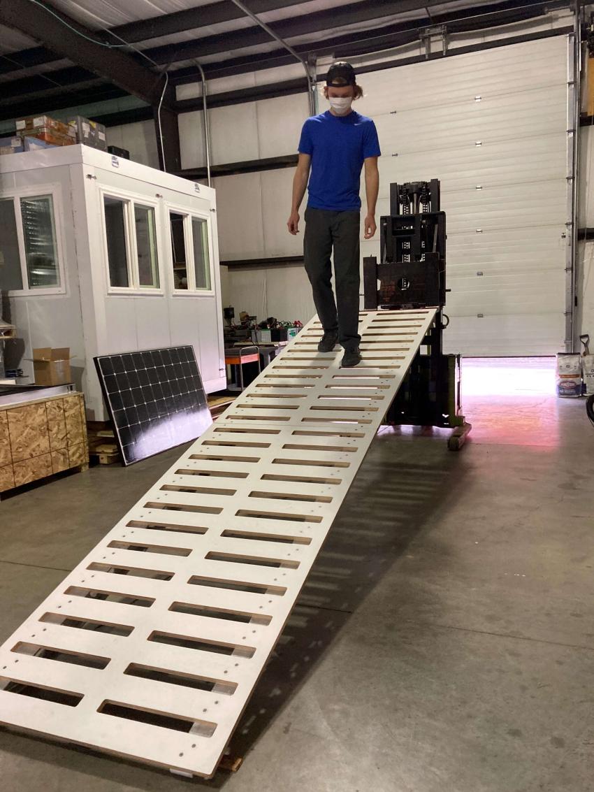 Elliot Moravec works on a new ramp designed and built for safer loading and unloading of small aircraft