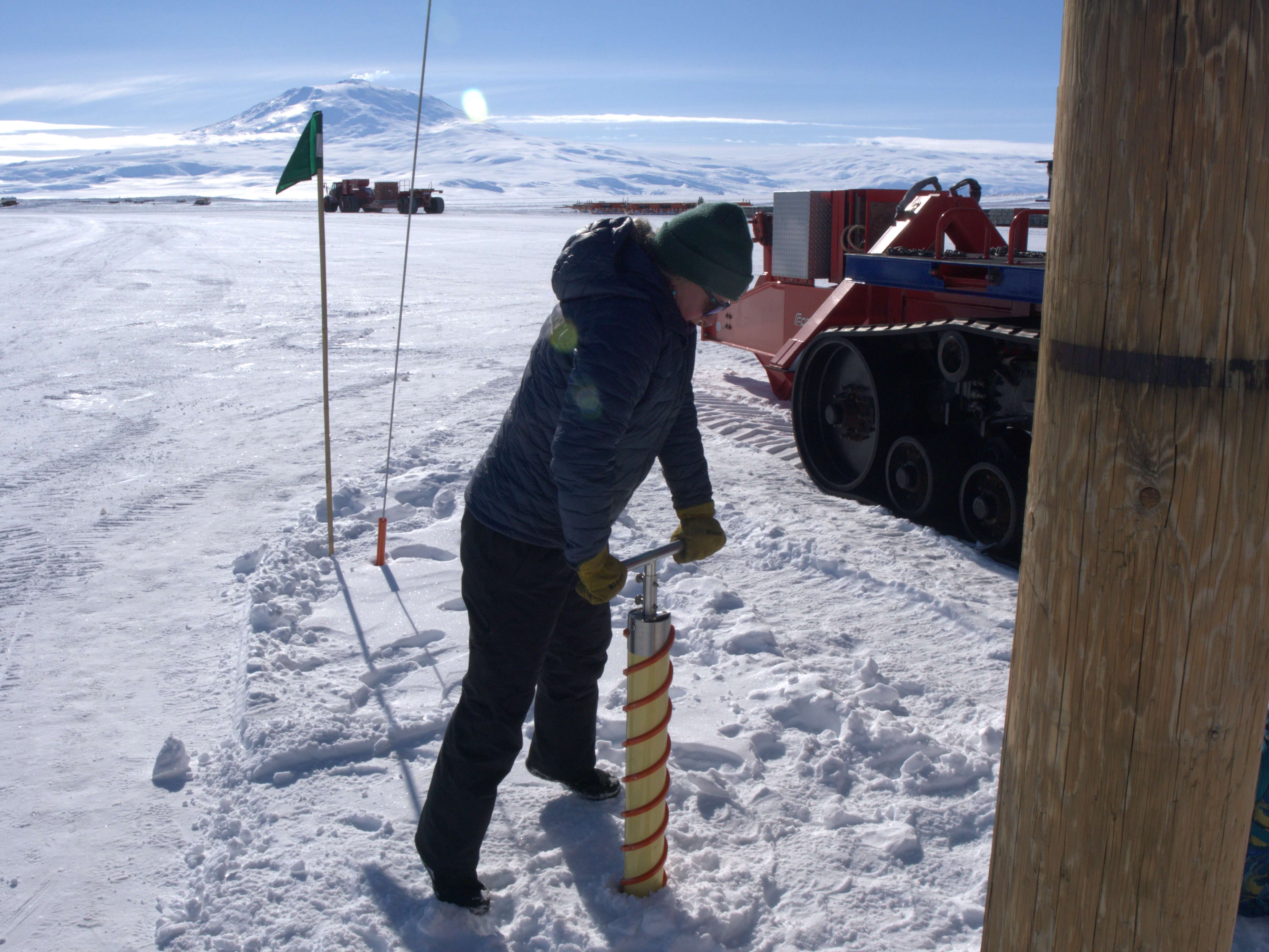 Julie Webber (McMurdo Station Crary Lab) tests the Kovacs Mark II hand auger on the McMurdo Ice Shelf. Credit: Parker Steen (Massachusetts Institute of Technology).