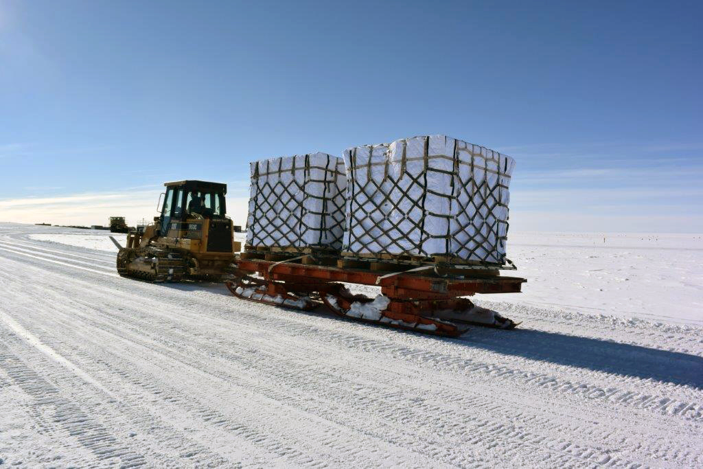 Ice cores being transported to South Pole skiway. Credit: Leah Street