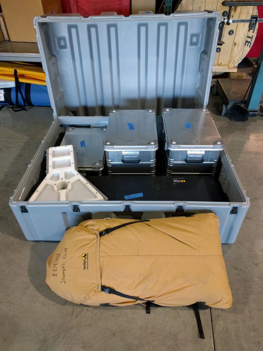 The shipping crate for the Stampfli Drill. Also shown is the optional tent (inside the brown/tan bag), which also fits inside the shipping crate