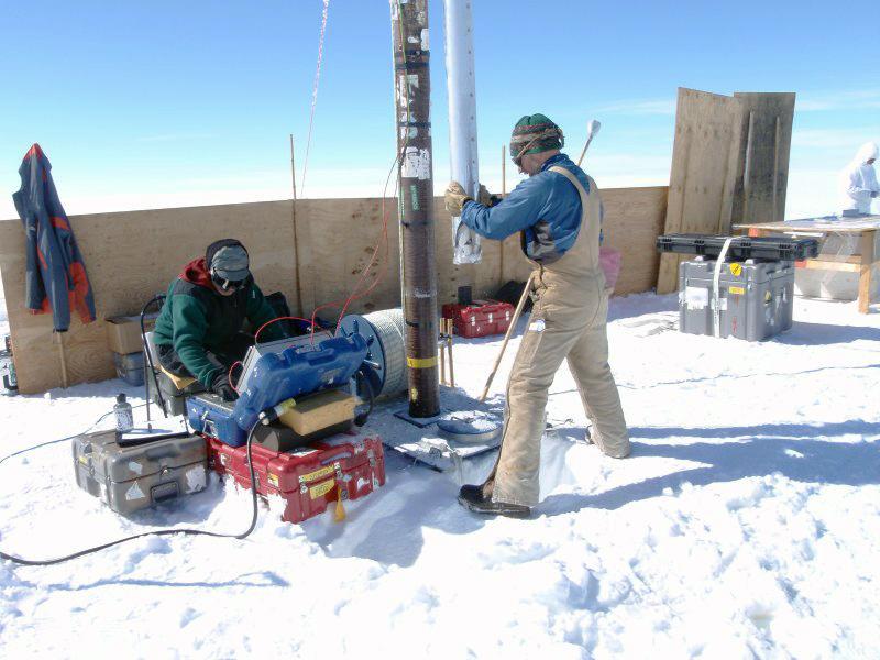 IDP driller Terry Gacke and scientist Bob Hawley drill an ice core in northern Greenland during the 2010 field season