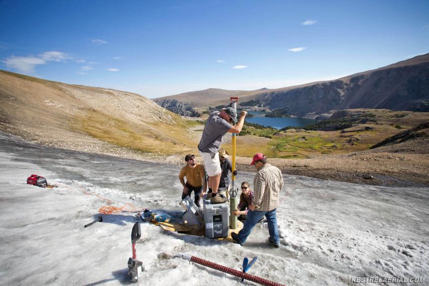 A field team led by Craig Lee (INSTAAR, UC-Boulder) and co-principal investigators David McWethy (Montana State University) and Greg Pederson (US Geological Survey) use the Prairie Dog Drill to recover a core from an ice patch in the Greater Yellowstone Area