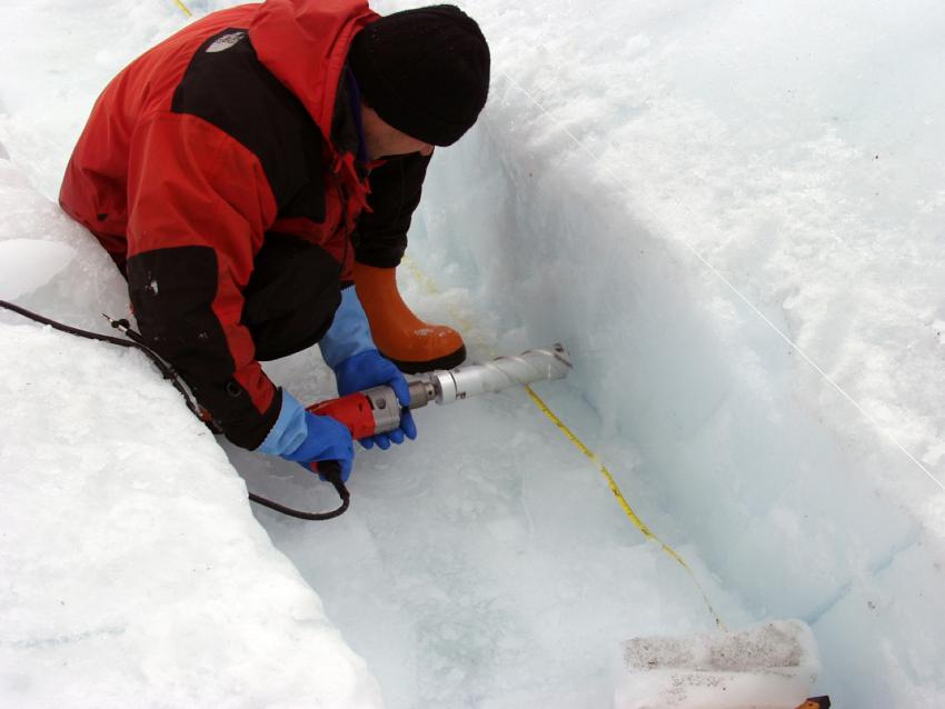 A scientist uses the Chipmunk Drill at Pakitsoq, West Greenland, in 2004 to recover samples of ice