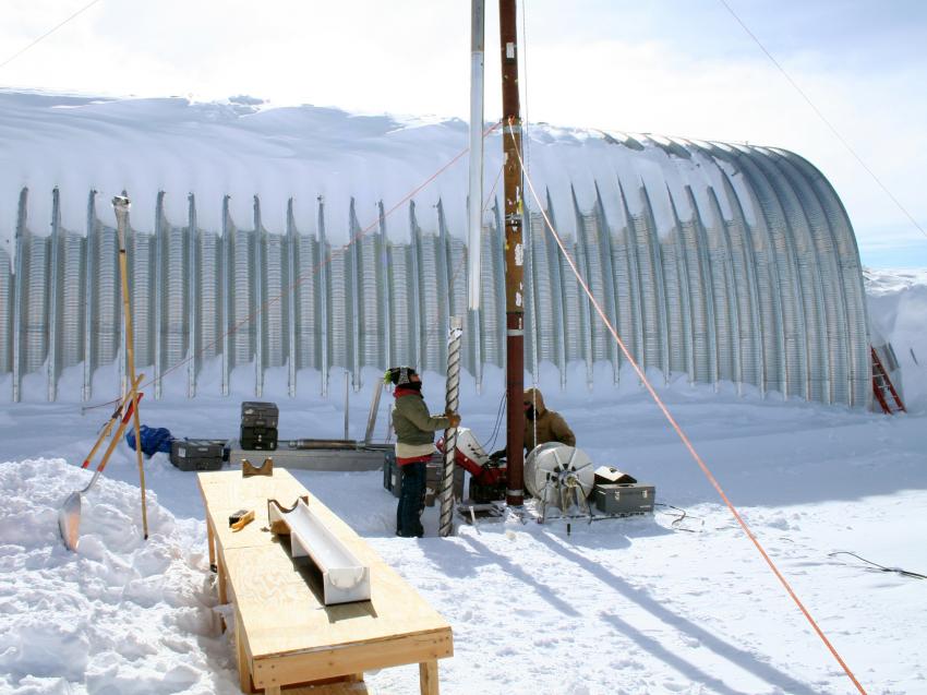 Beth Bergeron (left) and Michael Jayred (right) drilling a 130-meter deep ice core at WAIS Divide, Antarctica, during the 2006-2007 summer field season