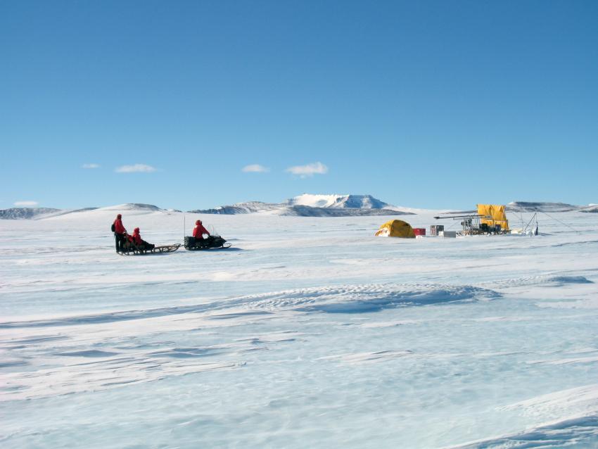 John Higgins, Nicole Spaulding and Andrei Kurbatov approach a shallow drill site at Allan Hills, Antarctica, during the 2009-2010 summer field season