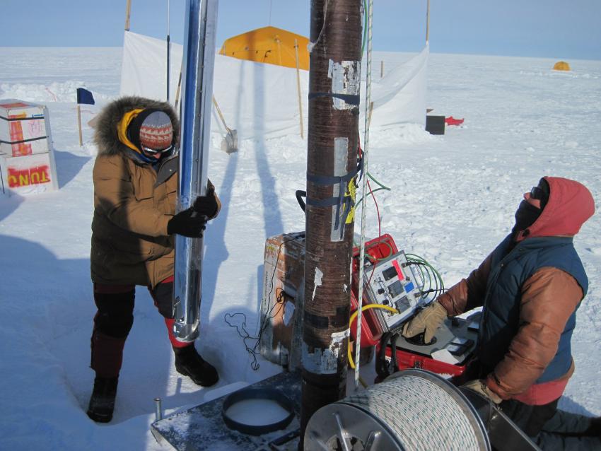IDP driller Beth Bergeron drilling a 200-meter deep ice core in northeast Greenland during the 2013 field season