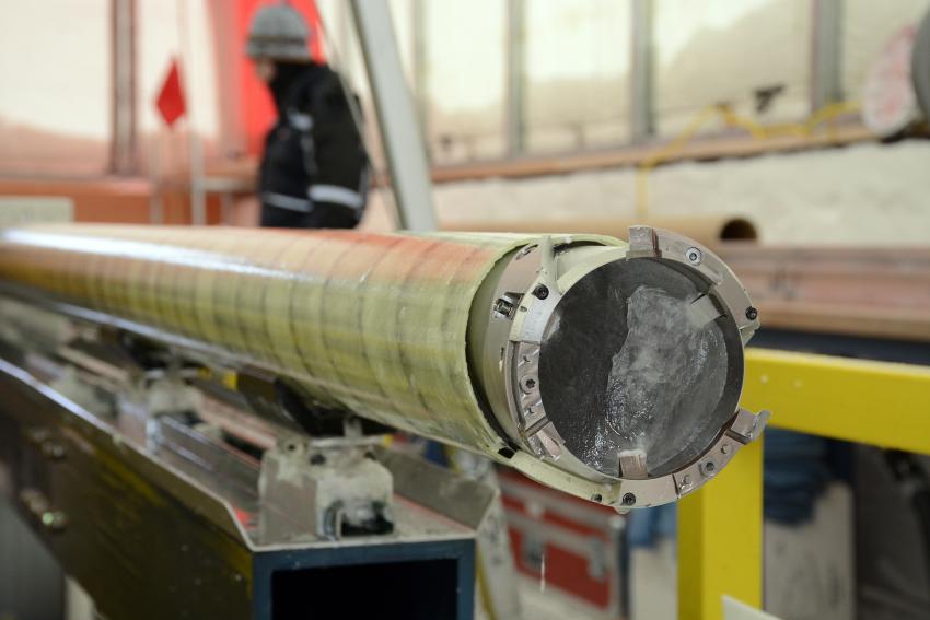 A close-up view of an ice core still in the IDD's drill barrel. Credit: Peter Rejcek