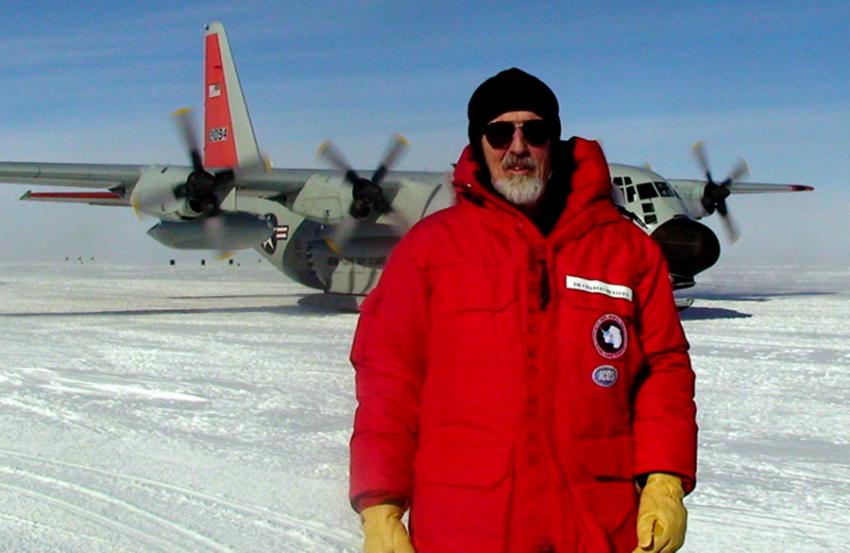 Charles Bentley stands in front of an LC-130 after arriving at the West Antarctic Ice Sheet (WAIS) Divide drilling camp in January 2008