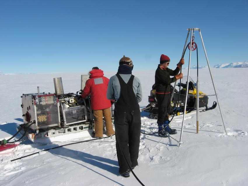 Drilling seismic shot holes with the portable hot water drill on Beardmore Glacier