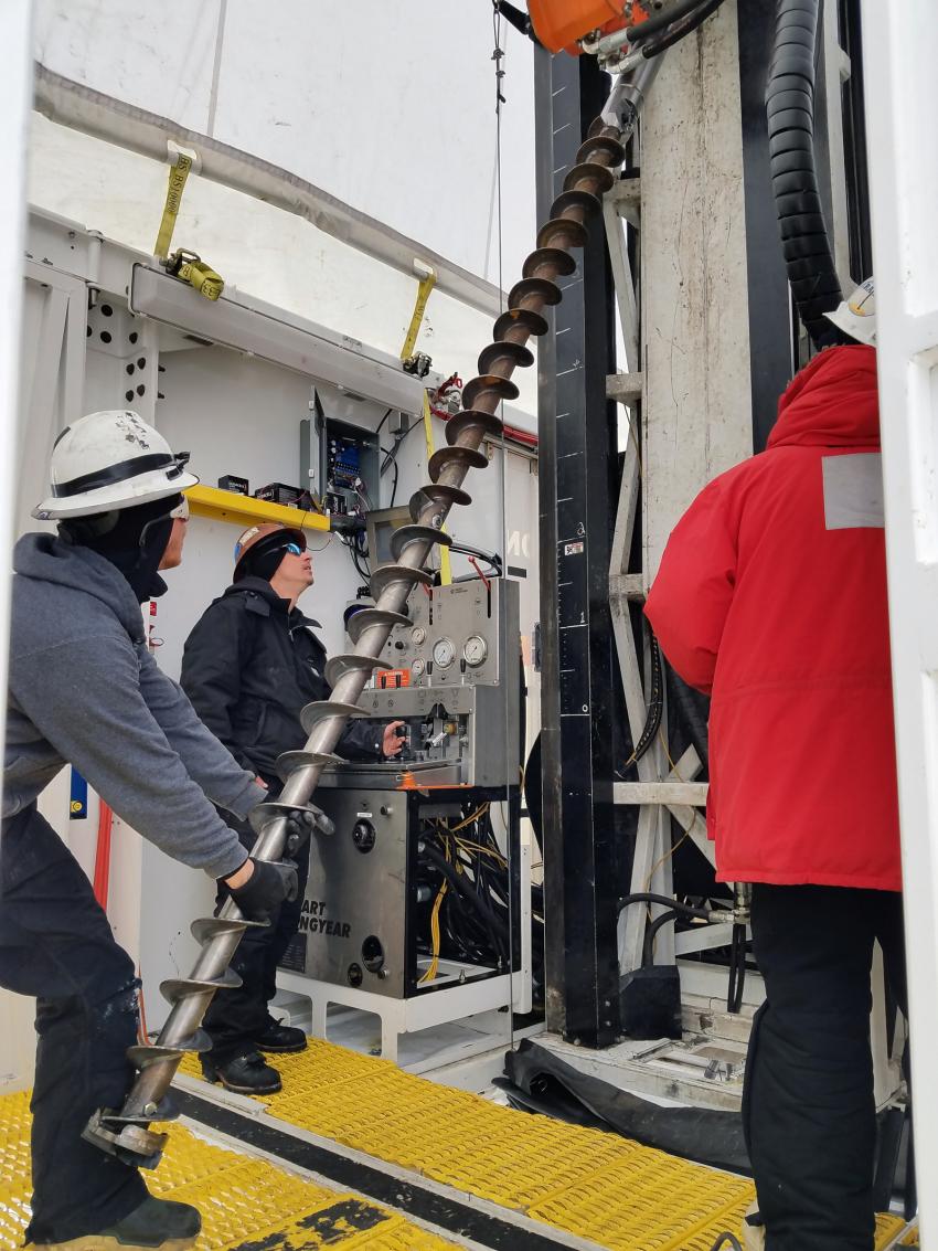Loading the 10-foot-long auger stem onto the Rapid Access Ice Drill (RAID)