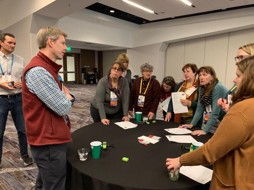 Erich Osterberg answers teachers’ questions while they work on a model of CO2 and isotope analysis during the Geophysical Information For Teachers (GIFT) workshop at the 2019 Fall AGU Meeting