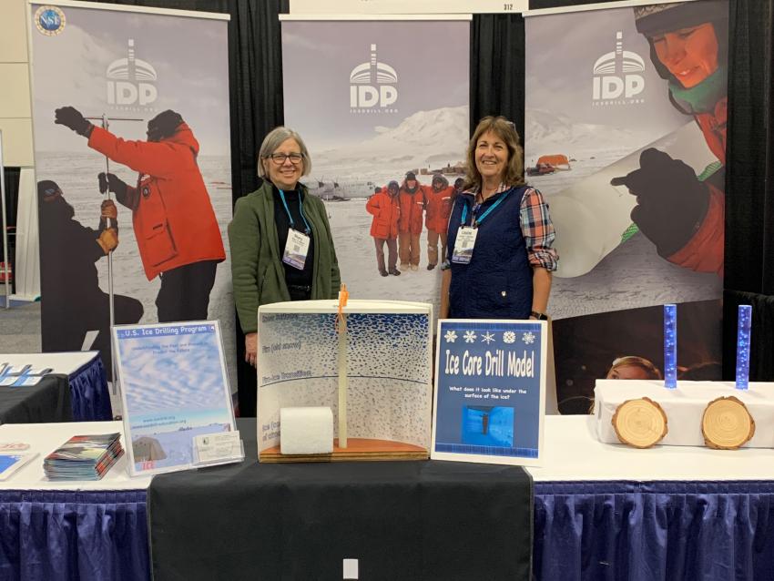 Mary Albert and Louise Huffman at the IDP booth during the 2019 Fall AGU Meeting