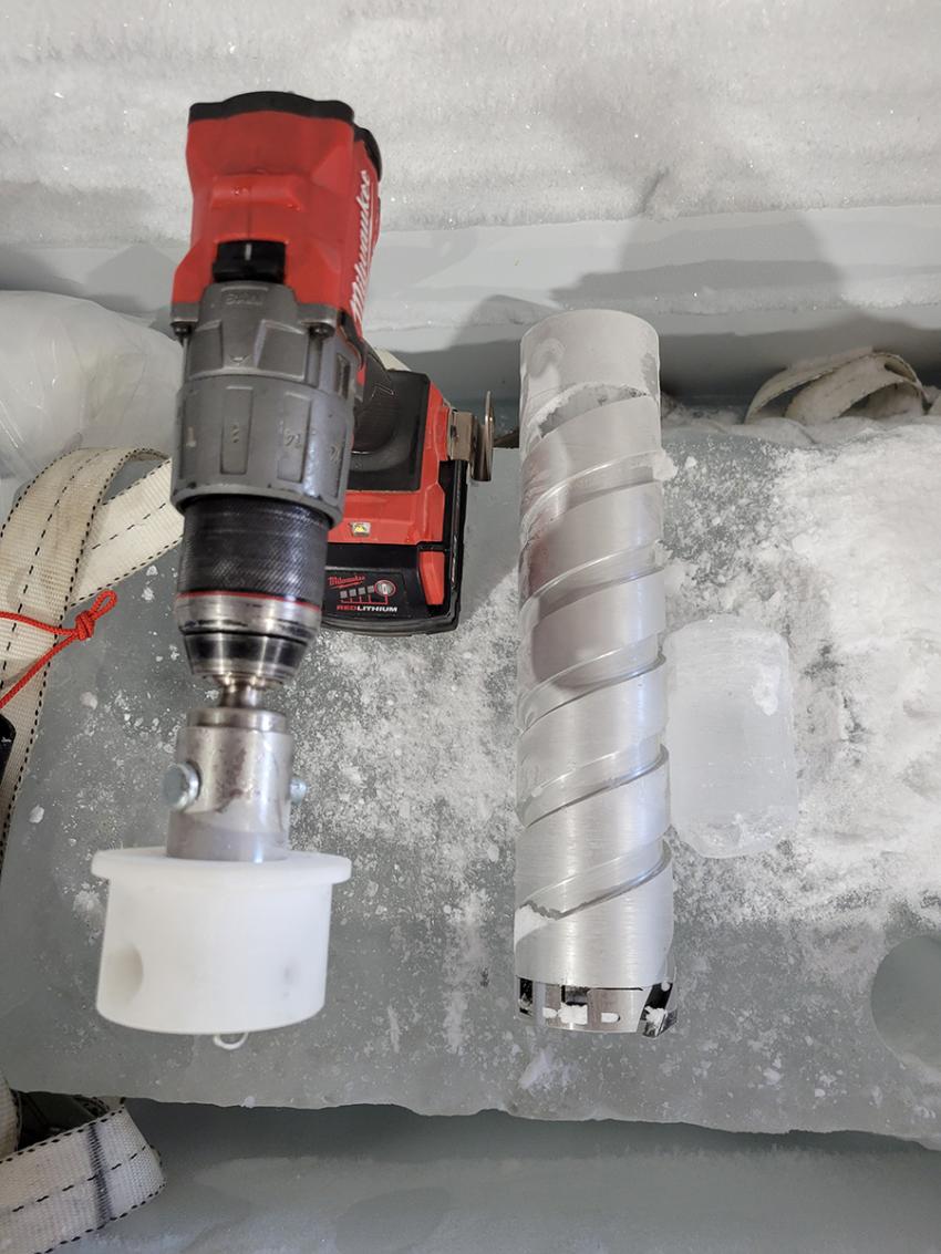 A Stampfli Drill core barrel is adapted for use with the Chipmunk Drill and tested in a chest freezer. Credit: Jay Johnson