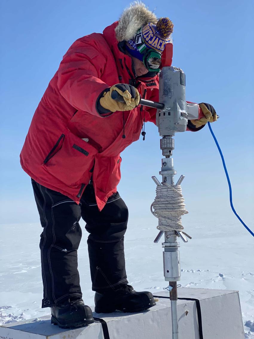Jihong Cole-Dai uses the Sidewinder (with the IDDO Hand Auger) to drill a firn core at Summit, Greenland