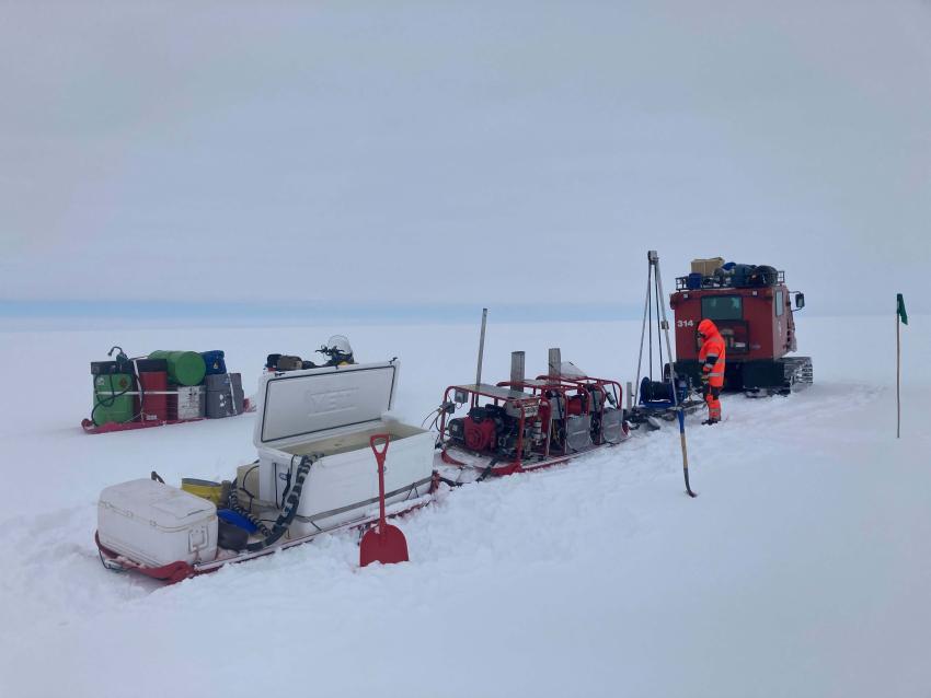 Small Hot Water Drill (SHWD) traverse setup. The SHWD was used at Lower Thwaites Glacier to drill thirty-two holes for seismic shot hole work. Credit: Tanner Kuhl.